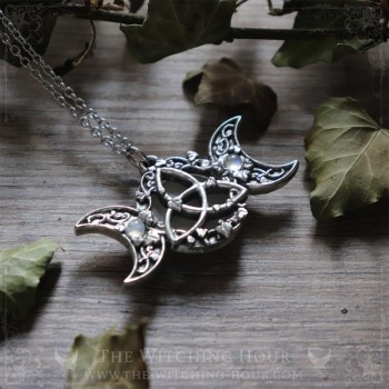 Triple moon and triquetra necklace surrounded by leaves