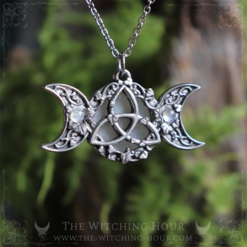 Triple moon and triquetra necklace surrounded by leaves