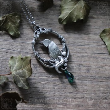 Cat necklace surrounded by leaves