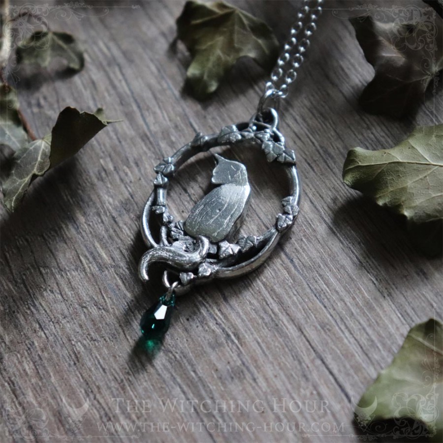 Cat necklace surrounded by leaves