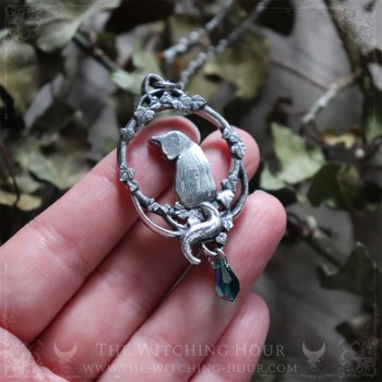 Cat necklace surrounded by leaves