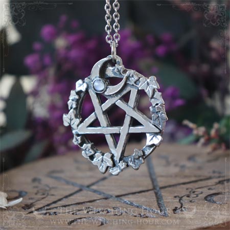 Inverted pentagram pendant surrounded by leaves